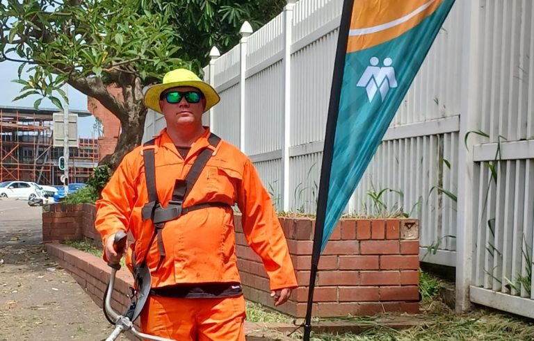 Queensburgh community cleans sidewalk step by step